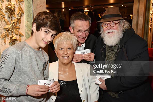 Young actor Talid Ariss, director Patrice Leconte and actor Albert Delpy pose with the wax statue of Mimie Mathy during 'Une Nuit Au Musee Grevin'...