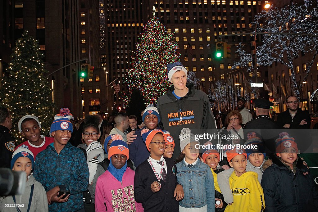 Kristaps Porzingis & Kids From The Garden Of Dreams Foundation Visit The Tree At Rockefeller Center