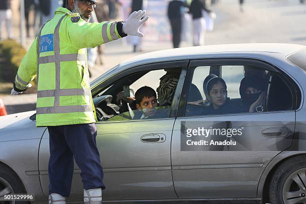Young Pakistanis look out a bus window on arrival to attend a ceremony to mark the first anniversary of the school massacre which left more than 130...