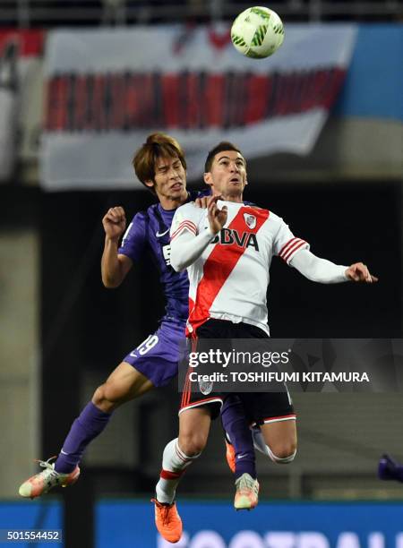 River Plate forward Lucas Alario fights for the ball with Sanfrecce Hiroshima defender Sho Sasaki during their Club World Cup semi-final football...