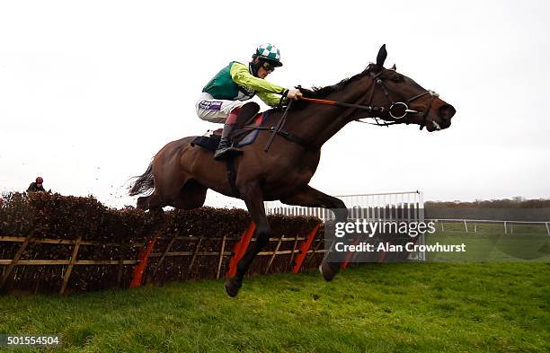 Sam Twiston-Davies riding Clan Des Obeaux clear the last to win The Blackmore Building Juvenile Hurdle Race at Newbury racecourse on December 16,...