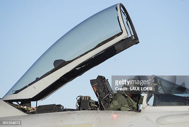 Royal Air Force pilot prepares his Eurofighter Typhoon aircraft for a flight during the inaugural Trilateral Exercise between the US Air Force,...