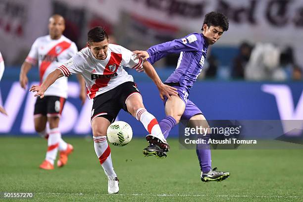 Matias Kranevitter of River Plate and Yusuke Chajima of Sanfrecce Hiroshima compete for the ball during the FIFA Club World Cup semi final match...