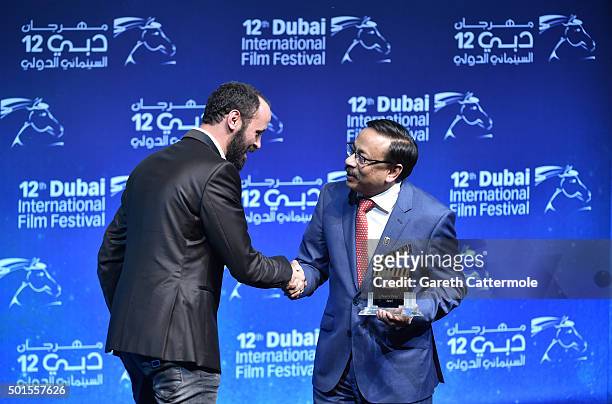 Actor Ali Suliman with the People's Choice award for "The Idol" during the Muhr Awards on day eight of the 12th annual Dubai International Film...