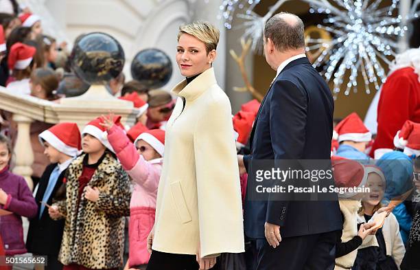Princess Charlene of Monaco and Prince Albert II of Monaco attend the Christmas gifts distribution on December 16, 2015 in Monaco, Monaco.