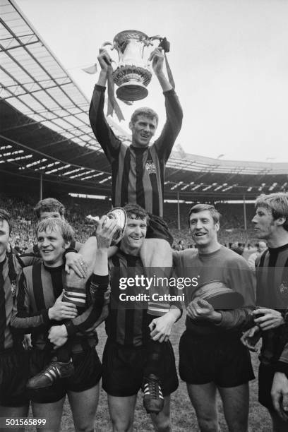 Manchester City captain Tony Book lifts the trophy after his team beat Leicester City 1-0 to win the FA Cup final at Wembley Stadium, London, 26th...