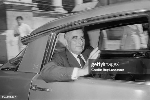 Former Prime Minister of France, Georges Pompidou waving from the back seat of a Citroen DS, Paris, 1st May 1969. Pompidou has recently announced his...