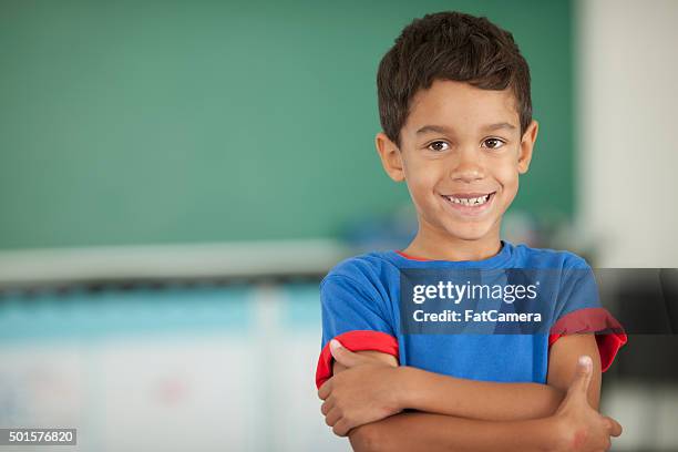 back to school - smiling boy in tshirt stockfoto's en -beelden