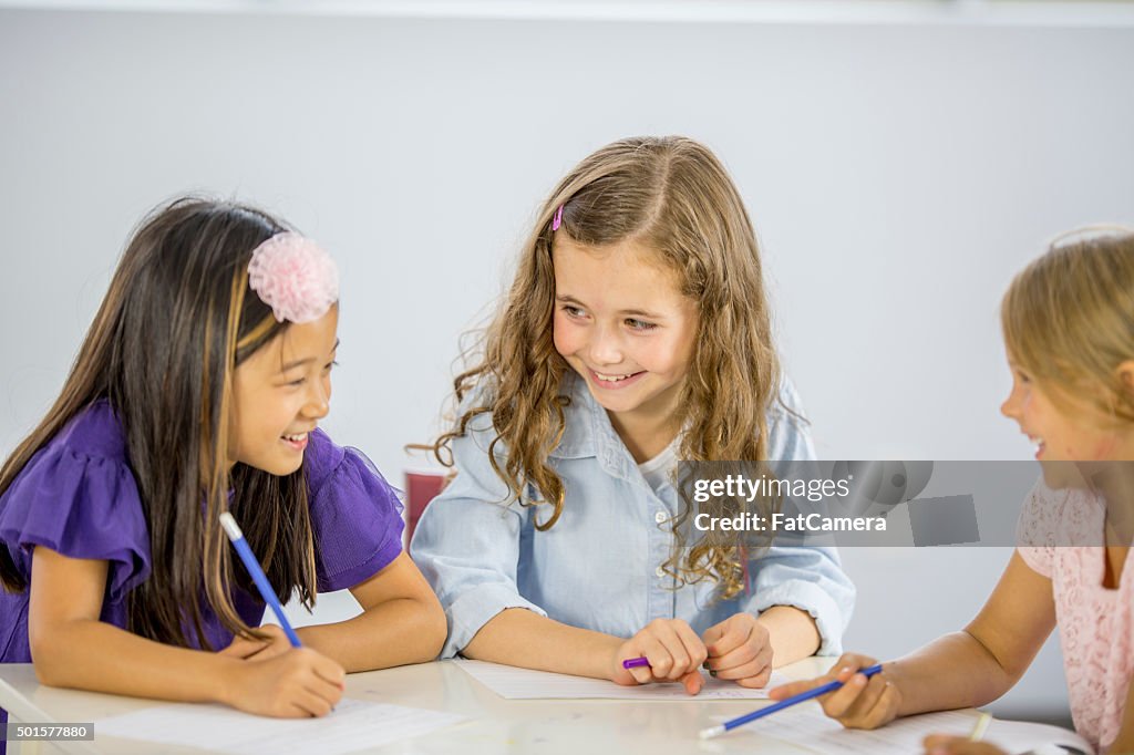 Girl Writing Assignment Girls Working On A Writing Assignment High-Res Stock Photo - Getty Images