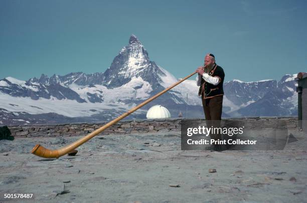 The Alpenhorn at Gonergat above Zermatt, with the Matterhorn behind, in the Swiss Alps.