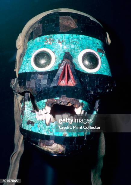 Aztec mask believed to represent Tezcatlipoca, modelled on a skull with the back cut away and lined with leather, 15th to 16th century. The jaw is...