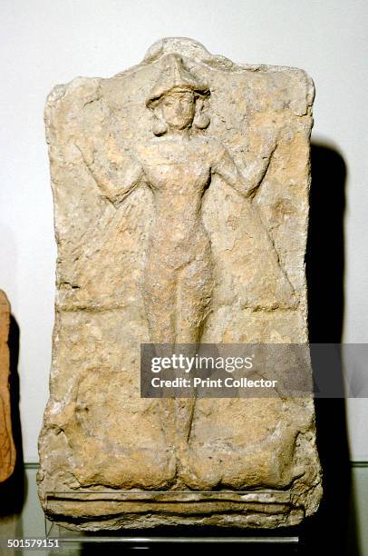 Terracotta relief of the goddess Astarte standing on two animals. Part of the collection at The Louvre.