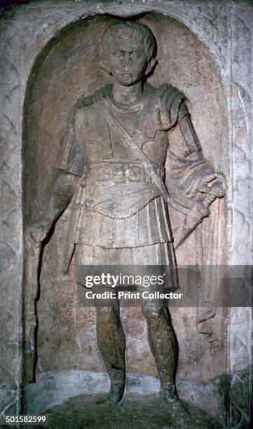 The Roman tombstone of Marcus Favonius Facilis, Centurion of the 20th legion of the Pollonian tribe , at Colchester Museum. He has a sword , dagger ,...