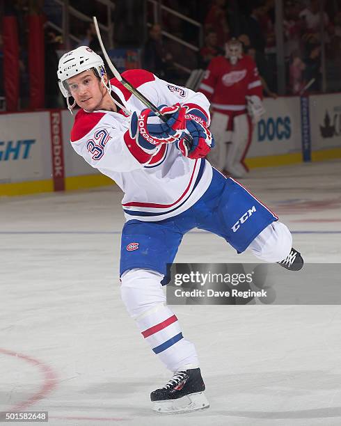 Brian Flynn of the Montreal Canadiens shoots the puck in warm-ups prior to an NHL game against the Detroit Red Wings at Joe Louis Arena on December...