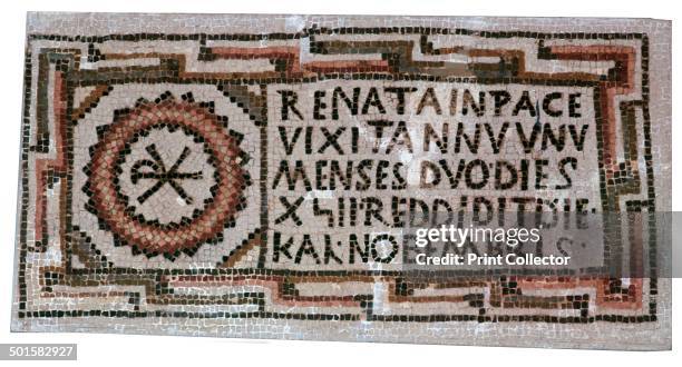 Early Christian mosaic with Christian symbols, i.e the Chi-Ro cross. The first line of the inscription reads 'having been renewed in peace'. From...