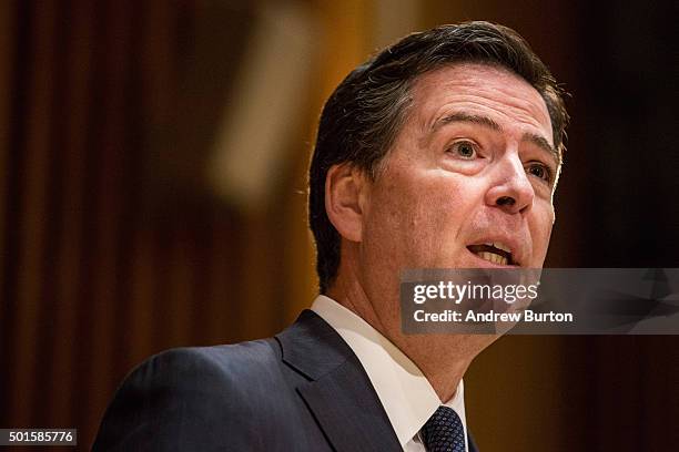 Federal Bureau of Investigation Director James Comey answers questions at a press conference after speaking at the New York Police Department Shield...