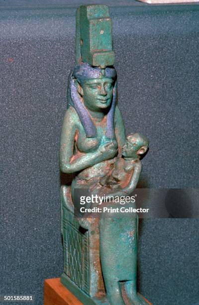 Bronze statuette of the Egyptian goddess Isis suckling Horus.