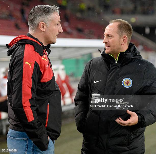 Coach Juergen Kramny of Stuttgart and Coach Torsten Lieberknecht of Braunschweig look on prior to the round of sixteen DFB Cup match between VfB...