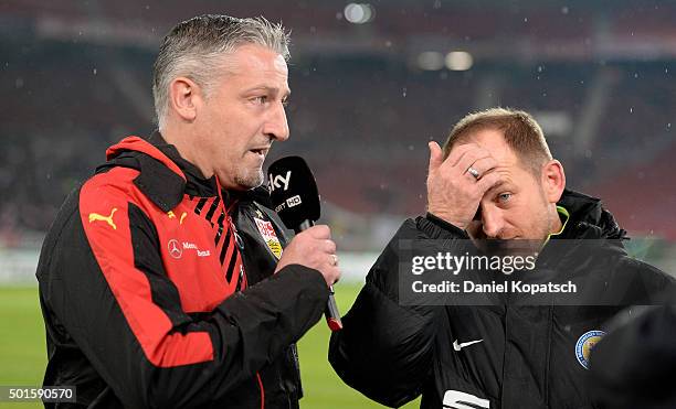 Coach Juergen Kramny of Stuttgart and Coach Torsten Lieberknecht of Braunschweig look on prior to the round of sixteen DFB Cup match between VfB...