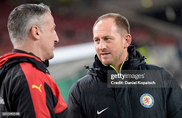 Coach Juergen Kramny of Stuttgart and Coach Torsten Lieberknecht of Braunschweig look on prior to the round of sixteen DFB Cup match between VfB...