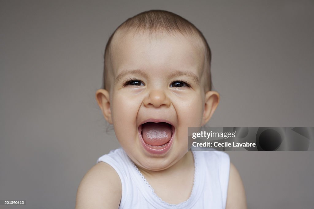 Portrait of baby giggling