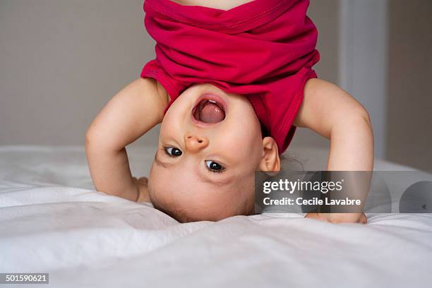 portrait of baby upside down - baby laughing stock pictures, royalty-free photos & images