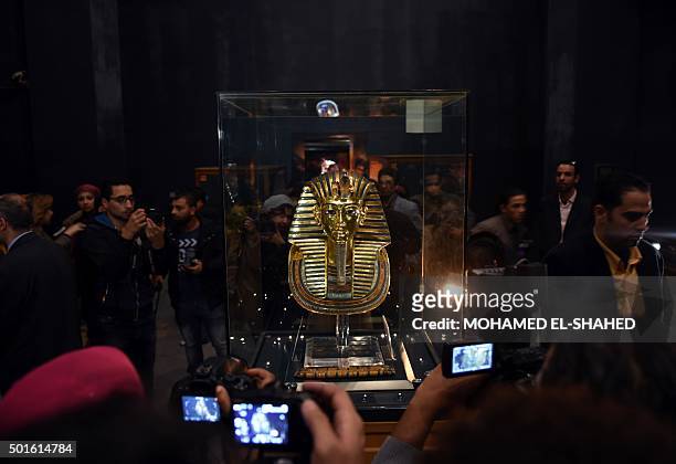 The golden funerary mask of legendary Egyptian boy king Tutankhamun is presented to the public at the Egyptian Museum in Cairo after its restoration,...