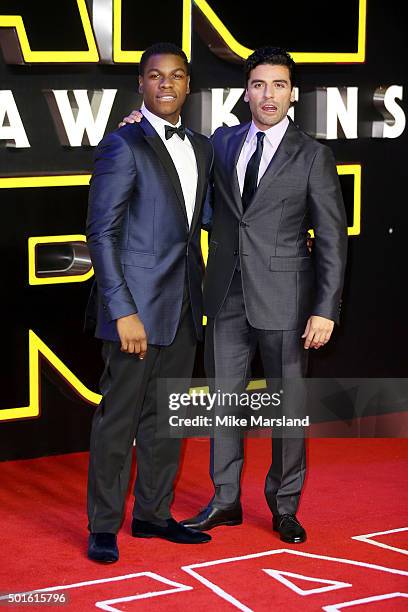 Actors John Boyega and Oscar Isaac attend the European Premiere of "Star Wars: The Force Awakens" at Leicester Square on December 16, 2015 in London,...