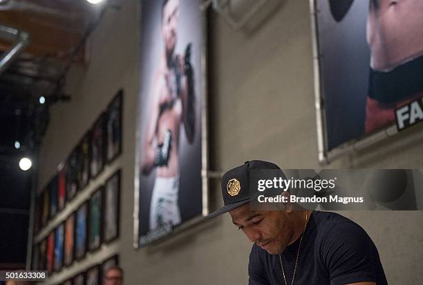 Featherweight champion Jose Aldo watches the semi-final fights during the filming of The Ultimate Fighter: Team McGregor vs Team Faber at the UFC TUF...