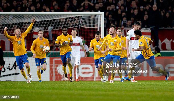 Ken Reichel of Braunschweig celebrates his team's second goal with team mates during the round of sixteen DFB Cup match between VfB Stuttgart and...