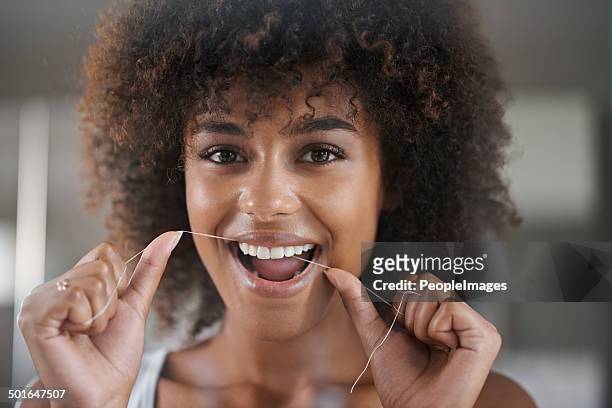 creating the perfect smile - flossing teeth stock pictures, royalty-free photos & images