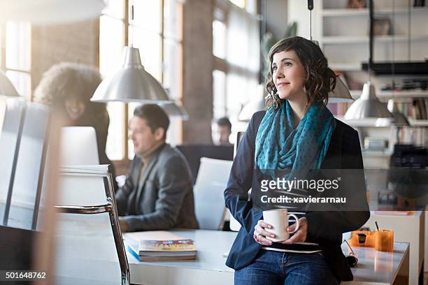 portrait of smiling office worker relax having a coffee - looking away stock pictures, royalty-free photos & images