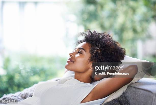 taking in some me-time - serene people stock pictures, royalty-free photos & images