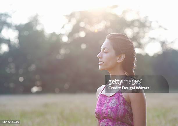 profile of woman with eyes closed - braiding hair stock pictures, royalty-free photos & images