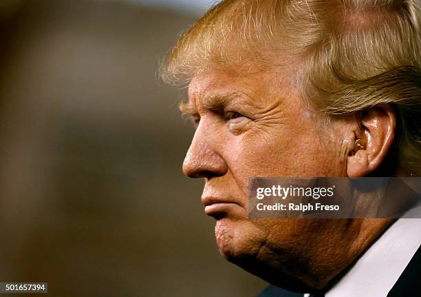 Republican presidential candidate Donald Trump peers out into the crowd during a campaign event at the International Air Response facility on...