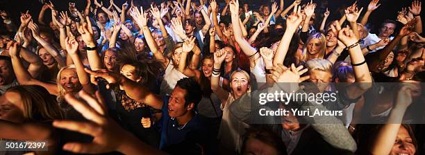 throngs of adoring fans - party atmosphere stock pictures, royalty-free photos & images