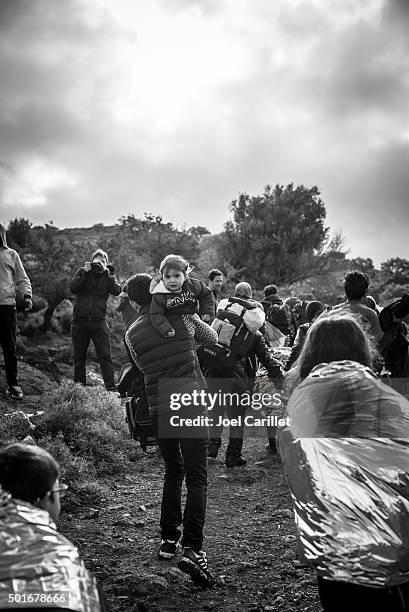 refugees arriving on lesbos, greece - refugee crisis stock pictures, royalty-free photos & images