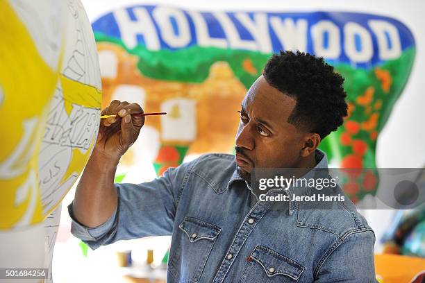 Actor Jaleel White celebrates Kobe Bryant's legacy with the Los Angeles Lakers by painting a mural of his famous vertical leap on a life sized cow...