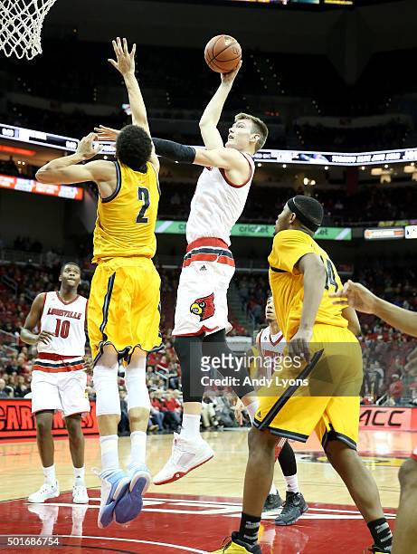 Matz Stockman of the Louisville Cardinals shoots the ball during the game against the Kennesaw State Owls at KFC YUM! Center on December 16, 2015 in...