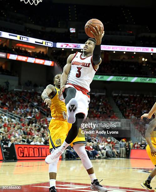 Trey Lewis of the Louisville Cardinals shoots the ball during the game against the Kennesaw State Owls at KFC YUM! Center on December 16, 2015 in...