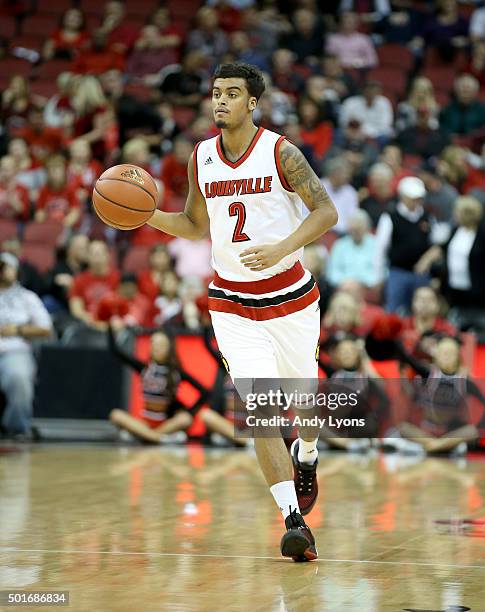 Quentin Snider of the Louisville Cardinals dribbles the ball during the game against the Kennesaw State Owls at KFC YUM! Center on December 16, 2015...