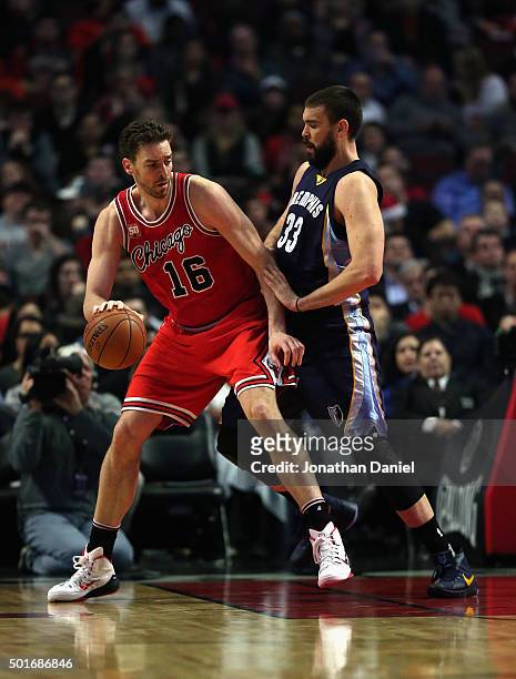 Pau Gasol of the Chicago Bulls moves against his brother Marc Gasol of the Memphis Grizzlies at the United Center on December 16, 2015 in Chicago,...