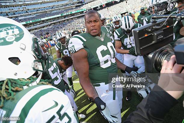 Tackle D'Brickashaw Ferguson of the New York Jets fires up his teammates before the game against the Miami Dolphins at MetLife Stadium on November...