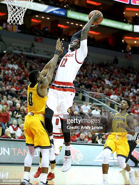 Mangok Mathiang of the Louisville Cardinals shoots the ball during the game against the Kennesaw State Owls at KFC YUM! Center on December 16, 2015...