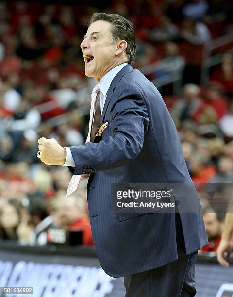 Rick Pitino the head coach of the Louisville Cardinals gives instructions to his team during the game against the Kennesaw State Owls at KFC YUM!...