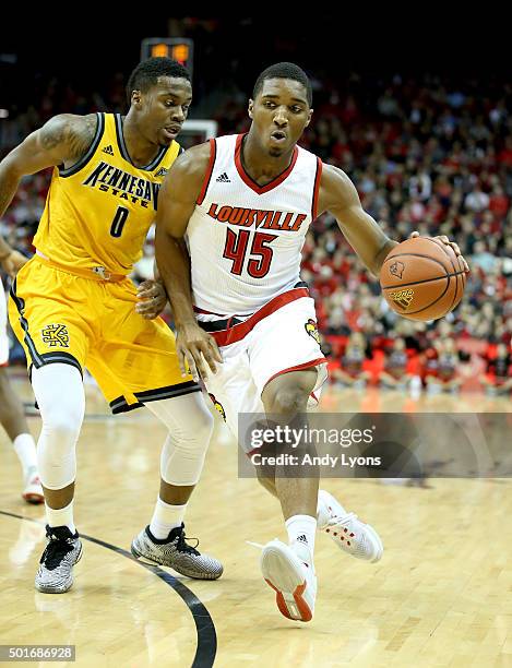 Donovan Mitchell of the Louisville Cardinals dribbles the ball during the game against the Kennesaw State Owls at KFC YUM! Center on December 16,...