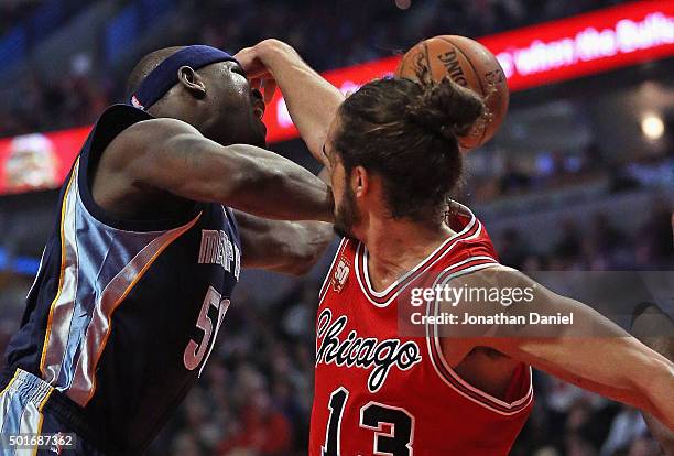 Joakim Noah of the Chicago Bulls fouls Zach Randolph of the Memphis Grizzlies at the United Center on December 16, 2015 in Chicago, Illinois. NOTE TO...