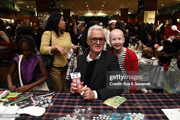John Slattery poses with St. Jude's patient child Kenlie at Brooks Brothers holiday celebration with St. Jude Children's Research Hospital Brooks...