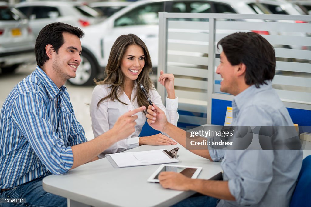 Couple buying a car