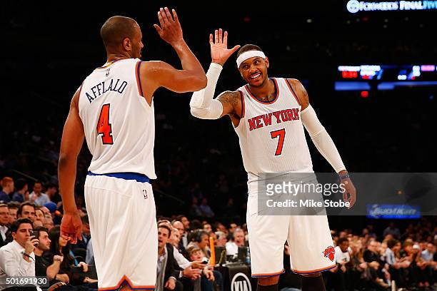 Carmelo Anthony of the New York Knicks and teammate Arron Afflalo celebrate against the Minnesota Timberwolves at Madison Square Garden on December...